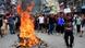 Demonstrators shout slogans next to fire burning on the street during a Kathmandu rally on September 9, 2025 Demonstrators shout slogans next to fire burning on the street during a Kathmandu rally on September 9, 2025
