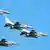 Cuatro F-16 de fabricación estadounidense volando en formación durante una parada militar en una imagen de archivo fechada en Polonia el 15.08.2023.