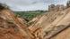 A man stands in the middle of a gully in the Democratic Republic of Congo. Photo by Matthias Vanmaercke A man stands in the middle of a gully in the Democratic Republic of Congo. Photo by Matthias Vanmaercke