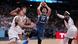 Luka Doncic rises with the ball amidst three German defenders Luka Doncic rises with the ball amidst three German defenders