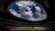 View of the National Stadium, with oval opening in roof giving a view of the sky with clouds View of the National Stadium, with oval opening in roof giving a view of the sky with clouds