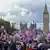 People carrying flags and banners gather at Stamford Street to stage a demonstration, organised by far-right activist Tommy Robinson 