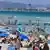 People sunbathing on Playa de Muro in Mallorca, Spain