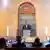 Bundeskanzler Friedrich Merz steht auf einem Podest in einem fstlkich beleuchteten Gottesdienstraum vor einem Vorhang beim Festakt zur Wiedereröffnung der Synagoge Reichenbachstraße in München