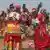 Malawi Congress Party (MCP) supporters dance ahead of the arrival of incumbent Malawi president and MCP presidential candidate Lazarus Chakwera during MCP's final campaign rally at Civo Stadium in Lilongwe, on September 13, 2025 