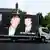 An image of US President Donald Trump alongside disgraced financier Jeffrey Epstein is displayed on a vehicle in Windsor, Britain