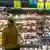 A woman shown looking at a shelf with packaged meat in a supermarket in Brazil 