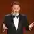 Jimmy Kimmel gesturing with his hand, looking toward camera