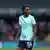 Grace Geyoro turns her head away from camera wearing a London City Lionesses shirt bearing the slogan: 'Everyone watches women's sports'