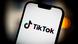 The TikTok logo on the screen of a smartphone The TikTok logo on the screen of a smartphone