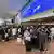 Long queues of people as travellers wait behind cordons at Brussels airport