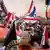 Protesters wave Dutch national flag as they take part in the 'Stand up for the Netherlands' rally in The Hague, on September 20, 2025