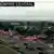 Police cars and ambulances stand outside a ICE facility where a shooting took place in Dallas, Texas, U.S. September 24, 2025 in this screengrab taken from a handout traffic camera video