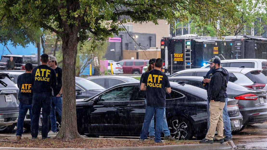 Law enforcement personnel respond at the scene of a shooting at an Immigration and Customs Enforcement (ICE) field office in Dallas, Texas on September 24, 2025