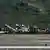 Maquinaria levanta los restos de una avioneta que se estrelló en el Aeropuerto Internacional Simón Bolívar en Maiquetía, Estado La Guaira, Venezuela.