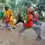 several children outdoors in Dar Es Salaam, Tanzania, taking part in a Kung fu class 