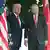 Trump ve Erdoğan, Beyaz Saray'ın bahçesinde yanlarında Türk ve Amerikan bayrakları ile basına poz veriyor 