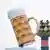 The fruit column, the symbol of the Cannstatter Wasen festival, is framed by an oversized beer mug 