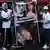 Protesters hold placards with the picture of three killed women, Brenda del Castillo, Morena Verdi and Lara Gutierrez, in Buenos Aires, Argentina, Saturday, Sept. 27, 2025.