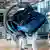 A picture of a VW car on the assembly line of a factory