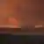 Ein Großbrand am Horizont über dem Etosha-Nationalpark