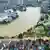 This aerial image shows flooding caused by rain following typhoon Bualoi in Lao Cai, Vietnam, Tuesday, Sept. 30, 2025. 