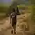 A file photo of a boy carrying a basket