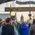 People standing at gate to the Oktoberfest