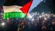 Blick auf viele Menschen bei einer Demonstration gegen den Gaza-Krieg in der Dämmerung im Zentrum Berlins. Zum Zeichen ihrer Solidarität schalteten viele Menschen die Taschenlampen ihrer Smartphones ein. In der ersten Reihe schwenkt ein Jugendlicher die Palästina-Fahne in den Farben Schwarz, Weiß, Grün und Rot Blick auf viele Menschen bei einer Demonstration gegen den Gaza-Krieg in der Dämmerung im Zentrum Berlins. Zum Zeichen ihrer Solidarität schalteten viele Menschen die Taschenlampen ihrer Smartphones ein. In der ersten Reihe schwenkt ein Jugendlicher die Palästina-Fahne in den Farben Schwarz, Weiß, Grün und Rot