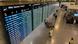 A small handful of people walk past a departure board indicating canceled flights inside the airport in Munich, Germany, October 3, 2025 A small handful of people walk past a departure board indicating canceled flights inside the airport in Munich, Germany, October 3, 2025