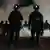 USA Portland 2025 | Law enforcement officers stand after deploying tear gas outside a U.S. Immigration and Customs Enforcement facility during a protest on Saturday,