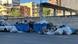 Overflowing blue bins and piles of refuse in bags and cardboard boxes line a city street, Tirana, Albania, September 2025 Overflowing blue bins and piles of refuse in bags and cardboard boxes line a city street, Tirana, Albania, September 2025