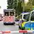 An ambulance and police car seen on a street
