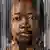 Collage showing several faces of Black people