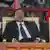 President Paul Biya and First Lady Chantal Biya are seated at a campaign rally.