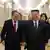 10月9日，金正恩和李强并肩而行去参加朝鲜劳动党成立80周年庆祝晚会