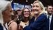 Marine Le Pen (R) reacts smiling and mingling during the Firefighters' conference in Le Mans, western France, on October 10, 2025 Marine Le Pen (R) reacts smiling and mingling during the Firefighters' conference in Le Mans, western France, on October 10, 2025