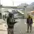 In this picture taken on February 2, 2023, Pakistan border police are pictured from the zero point Torkham border crossing between Afghanistan and Pakistan, in Nangarhar province.