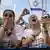 Three women react to a live broadcast of Israeli hostages released from Gaza