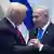 President Donald Trump talks with Israel's Prime Minister Benjamin Netanyahu at the Knesset