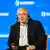 Mikhail Khodorkovsky seen seated and wearing audio headphones at the Globsec security confererence in Prague, Czech Republic (September 1, 2024)