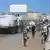 Aid trucks pass by, as people walk on streets, Gaza, October 14,