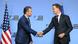 Pete Hegseth and Mark Rutte, two suited men shaking hands