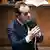 France s Prime Minister Sebastien Lecornu (portrait) answers a question from a member of parliament from a left-wing opposition group