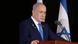 İsrail Başbakanı Netanyahu kürsüde. Yanında İsrail bayrağı var. İsrail Başbakanı Netanyahu kürsüde. Yanında İsrail bayrağı var.