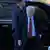 John Bolton steps out of car