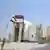 An Iranian security walks in front of the nuclear power plant in Bushehr