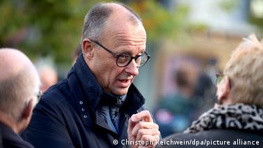 German Chancellor Friedrich Merz speaking to citizens