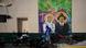 "Santos para todos", se lee en este mural que representa a María del Carmen Rendiles y a José Gregorio Hernández en una calle del barrio de La Pastora, en Caracas, fotografiado ayer.