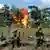 Anti-narcotics police officers blow up a laboratory for processing cocaine